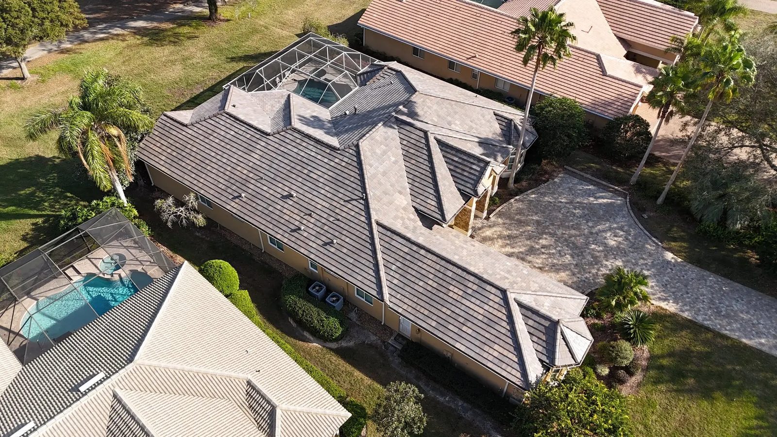 Aerial view of a large tile roof estate home